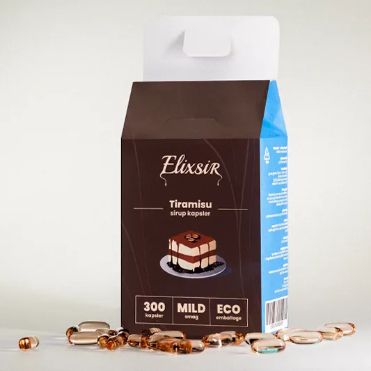 Elixsir Tiramisu box seen at an angle, surrounded by brown capsules, showing the blue side and open top.