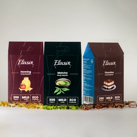 Three Elixsir boxes with the flavors Honey, Matcha, and Tiramisu in a row with colored capsules in front, on a light background.