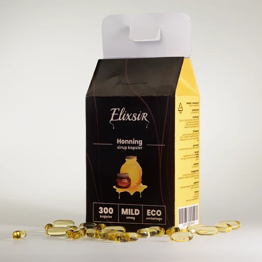 Elixsir Honey syrup capsules box with yellow side panel, surrounded by golden capsules on a neutral surface.