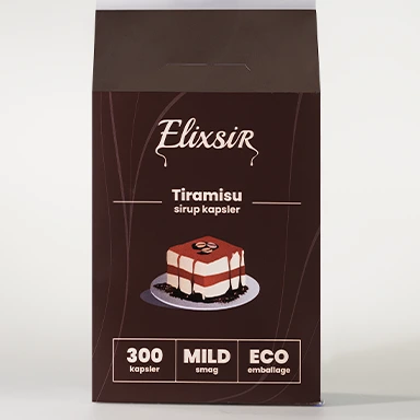 Front view of the Elixsir Tiramisu syrup capsules box in dark brown packaging. The design features an illustration of a tiramisu dessert and labels showing “300 capsules,” “MILD taste,” and “ECO packaging.”